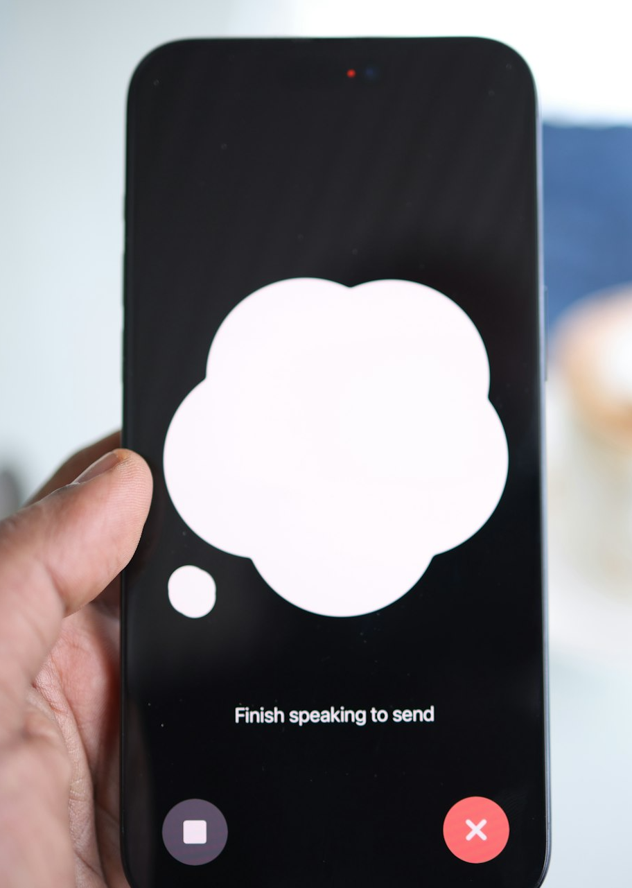a person holding a cell phone with a speech bubble on the screen